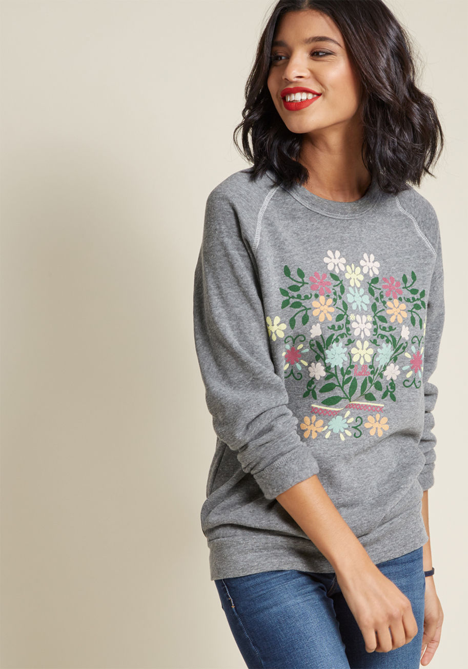 The Olga - For every enthusiastic greeting you put out into the atmosphere while sporting this grey sweatshirt, you're sure to receive matching respects! A lovely bouquet graphic