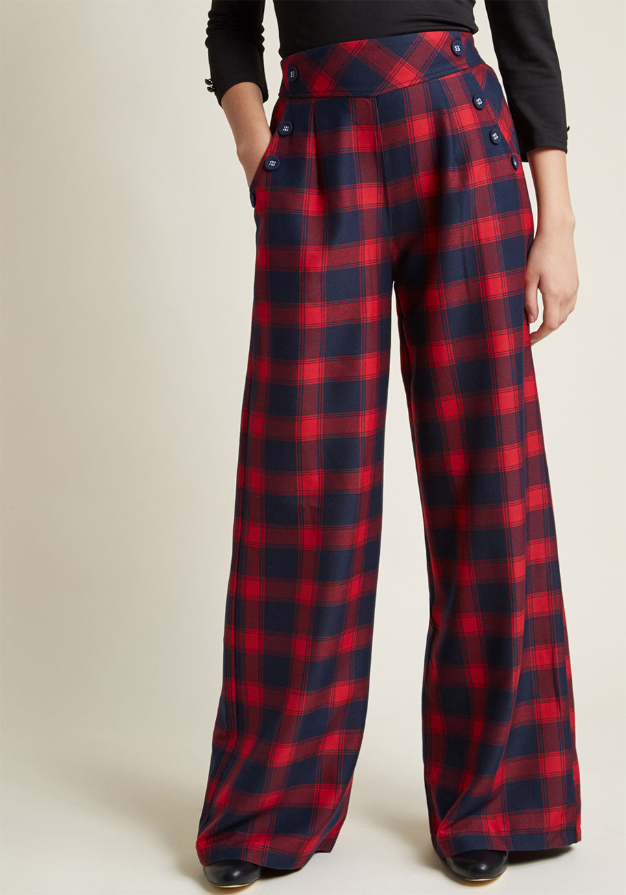 TRA4542 - Your surefire way to nail the networking event begins with these plaid pants. The vintage-inspired vibe this navy and red pair emanates is a guaranteed icebreaker, for its wide legs and button accents inspire plenty of talking points, allowing your style 