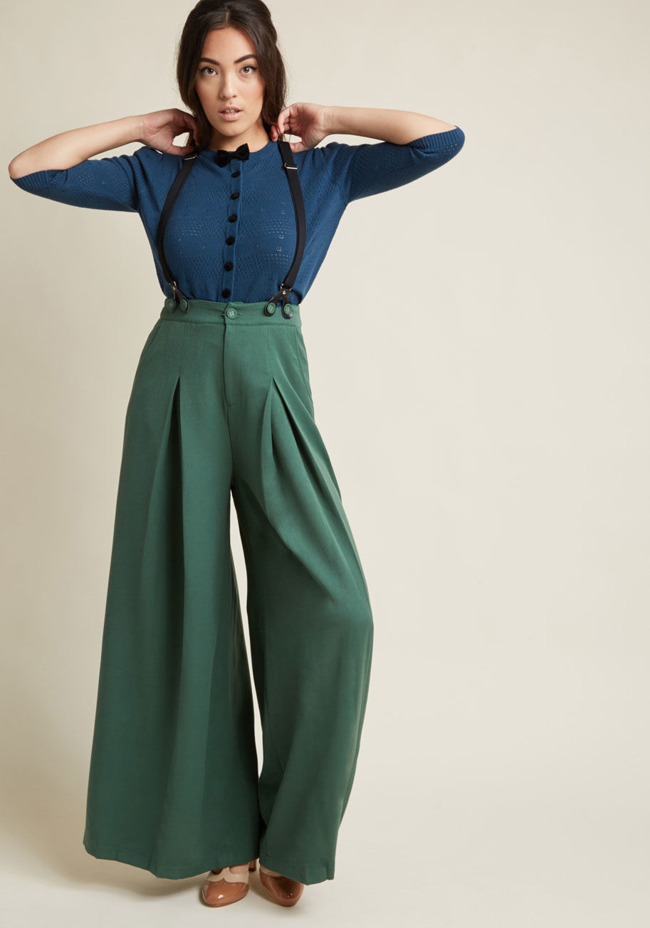 TRA4547 - Demonstrate a dapper aesthetic with the posh professionalism of these wide-leg trousers! Pocketed, dramatically pleated down the front and back of each leg, and starring spiffy, stretchy suspenders that button to the waistband, these bold green bottoms du