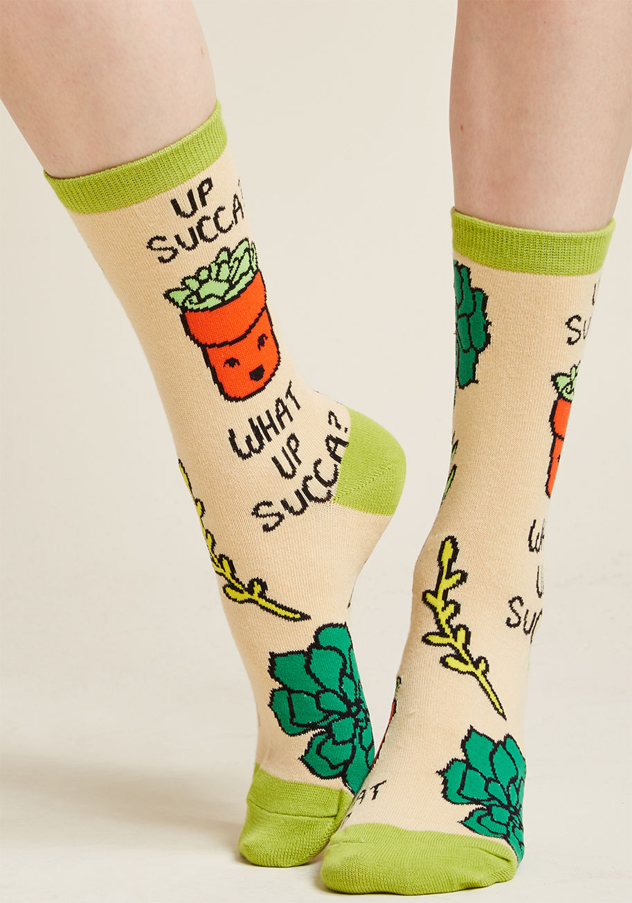 WD7002C - Slipping these quirky socks over your feet is the best way to greet the day! A fun-loving, succulent-rich print framed by lime green tops, heels, and toes details the ivory hue of these cool crews - a pair for which your adoration will grow with every wea