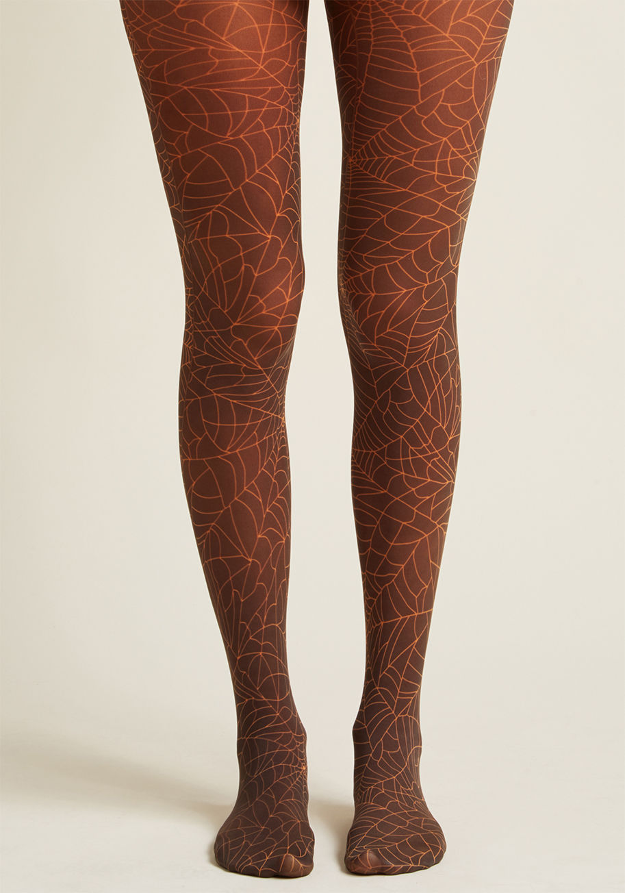 webber b printed tights - Gone are the days when drab duds enter your ensemble - now styles like these black tights are the norm! Patterned with orange spider webs that are as festive for Halloween as they are marvelously macabre for the rest of the season, this pair puts your qui