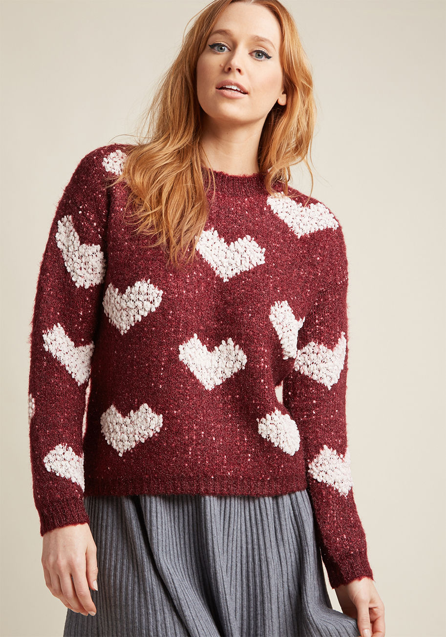 WI17MAC21 - Upon pulling this burgundy sweater from Compania Fantastica over your head, you're overcome with the sensation of easy days being here to say! White chenille hearts and fuzzy fabric liven up the crew neckline and drop shoulders of this lovely layer, as th