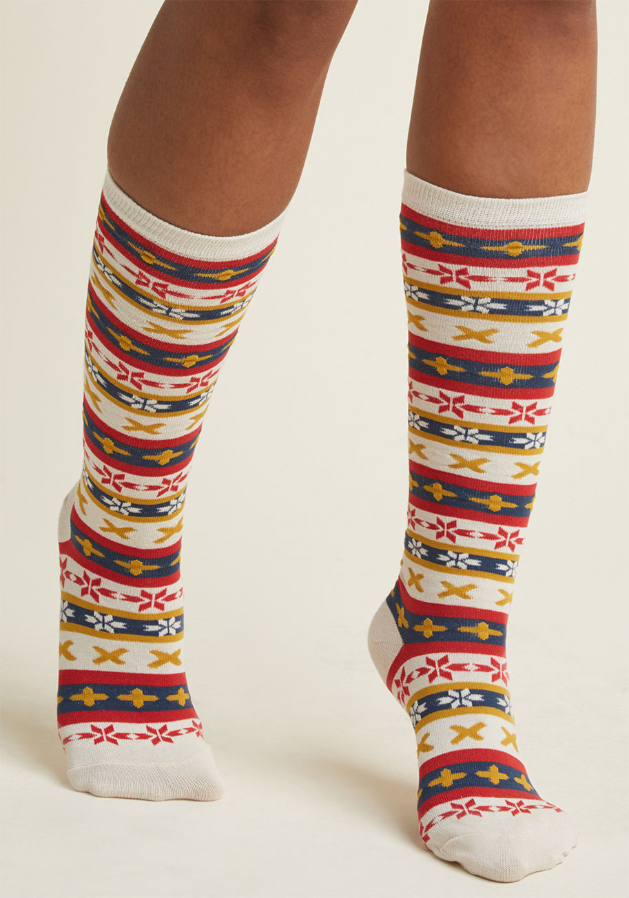 wj5319k - Anytime you're up early, it's probably to slip into these Fair Isle knee socks and set out to see the sunrise! With a red, rich yellow, and navy blue pattern, this off-white pair is the portrait of how an early morning hike should be accessorized.