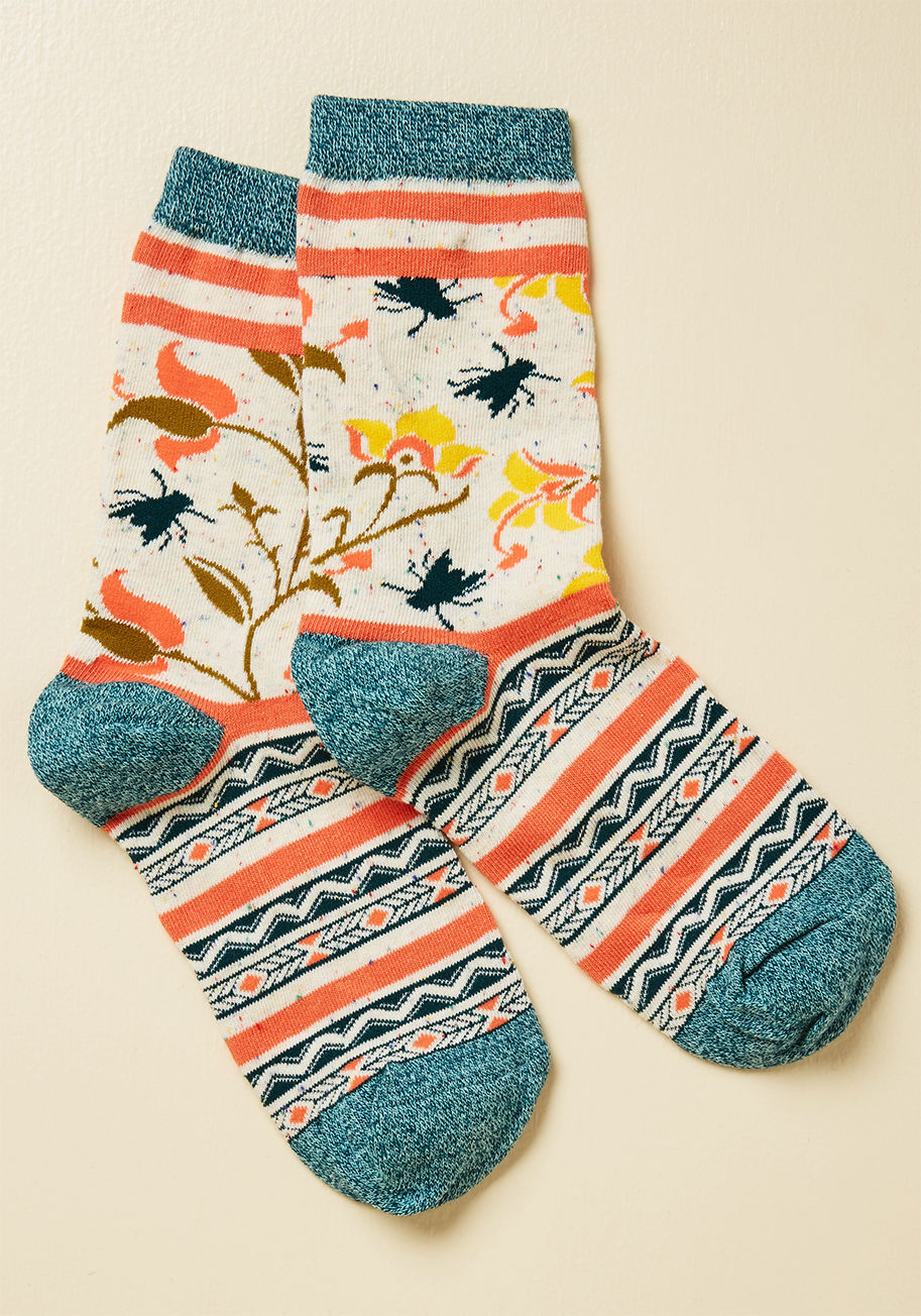 WJ7201C - Please, oh please won't you take these colorful socks for a spin? Striped from top to toe with heather blue, coral pink, and ivory hues, and festooned with a fine juxtaposition of geometric patterns and prints of insects and flowers, this pair is certainl