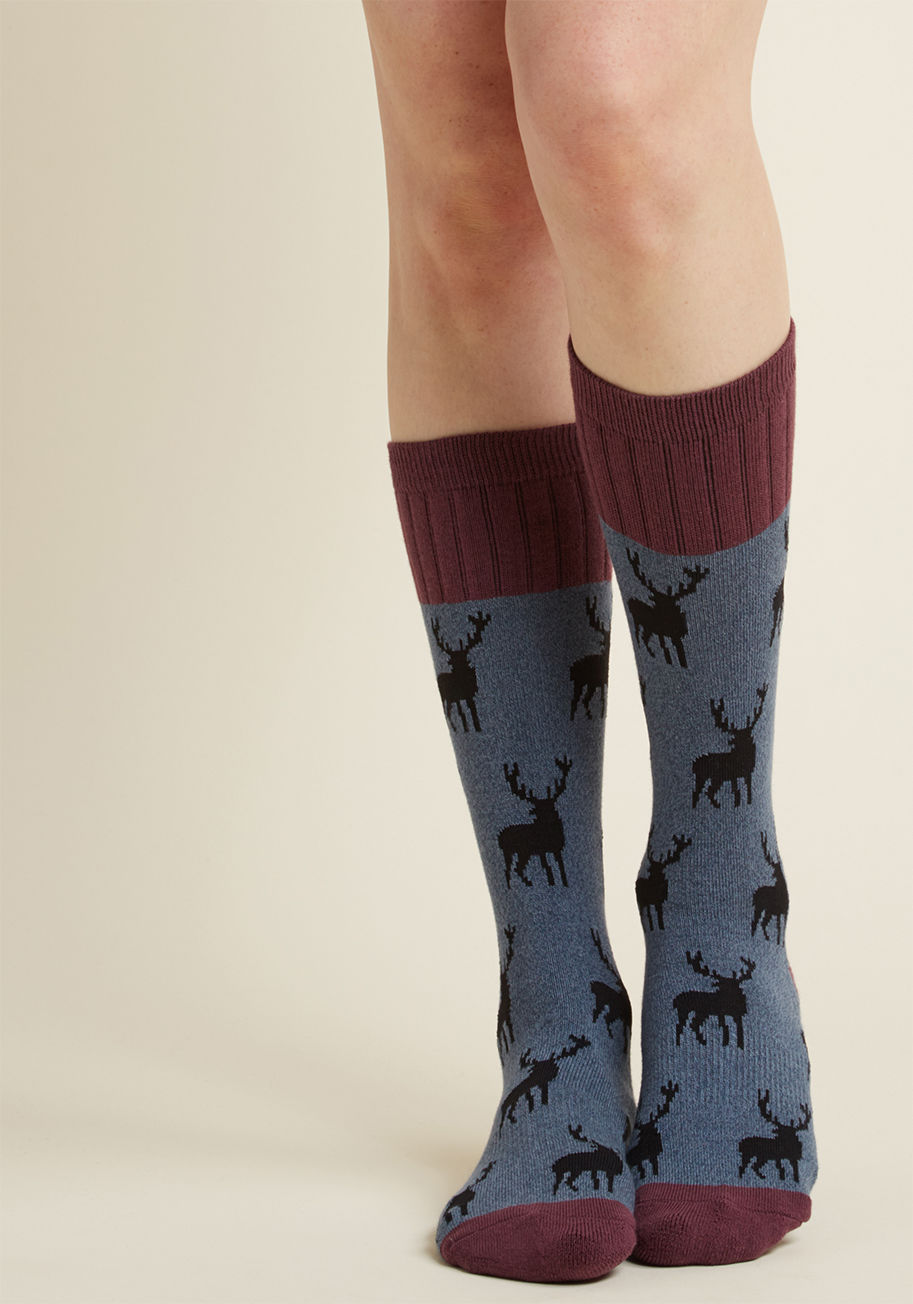 WOB990 - Do you hear that? Why, it's the voice of reason saying these blue socks offer the perfect peppering of quirk for your wardrobe! Printed with black deer aplenty and capped at the calves, heels, and toes with a maroon hue, this pair is one you've just gotta