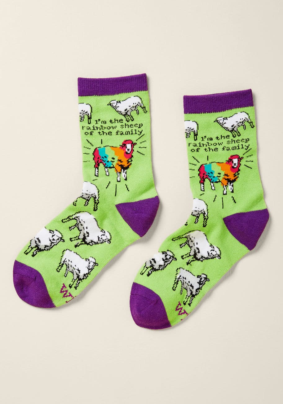 WT-1004-24 - Flaunt your free-spirited ways with these bright green socks! A proclamation of your fun-loving status within the fam is presented atop this purple-capped pair by way of a multicolored sheep rockin' the flock. Never change, you original icon, you!