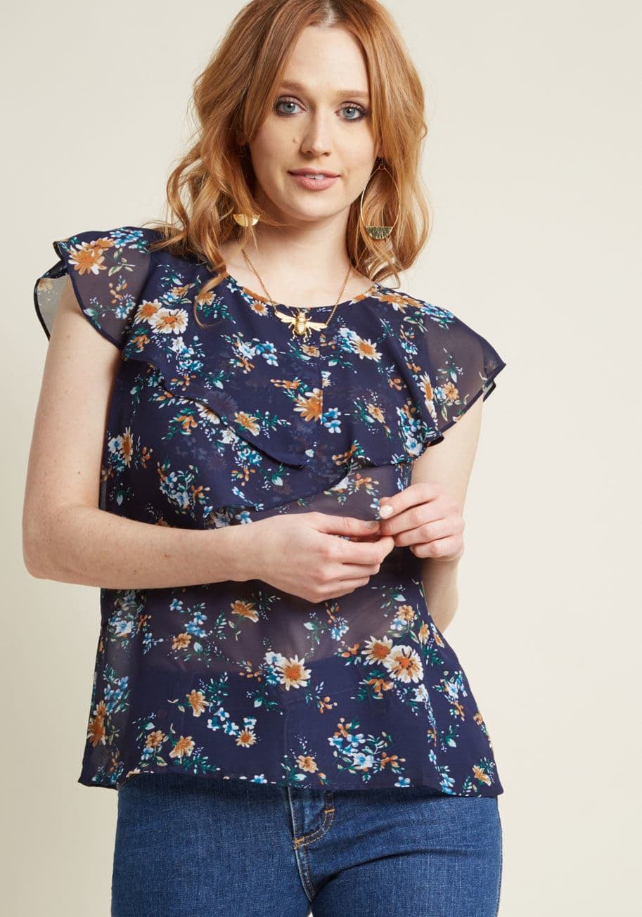 WT-21571 - It's as though a fashion fairy waved her wand around your navy blue blouse, and where her stardust fell, gently wrapping ruffles appeared! Not only are the tiers encircling the shoulders and falling across the front of this ModCloth-exclusive top charming