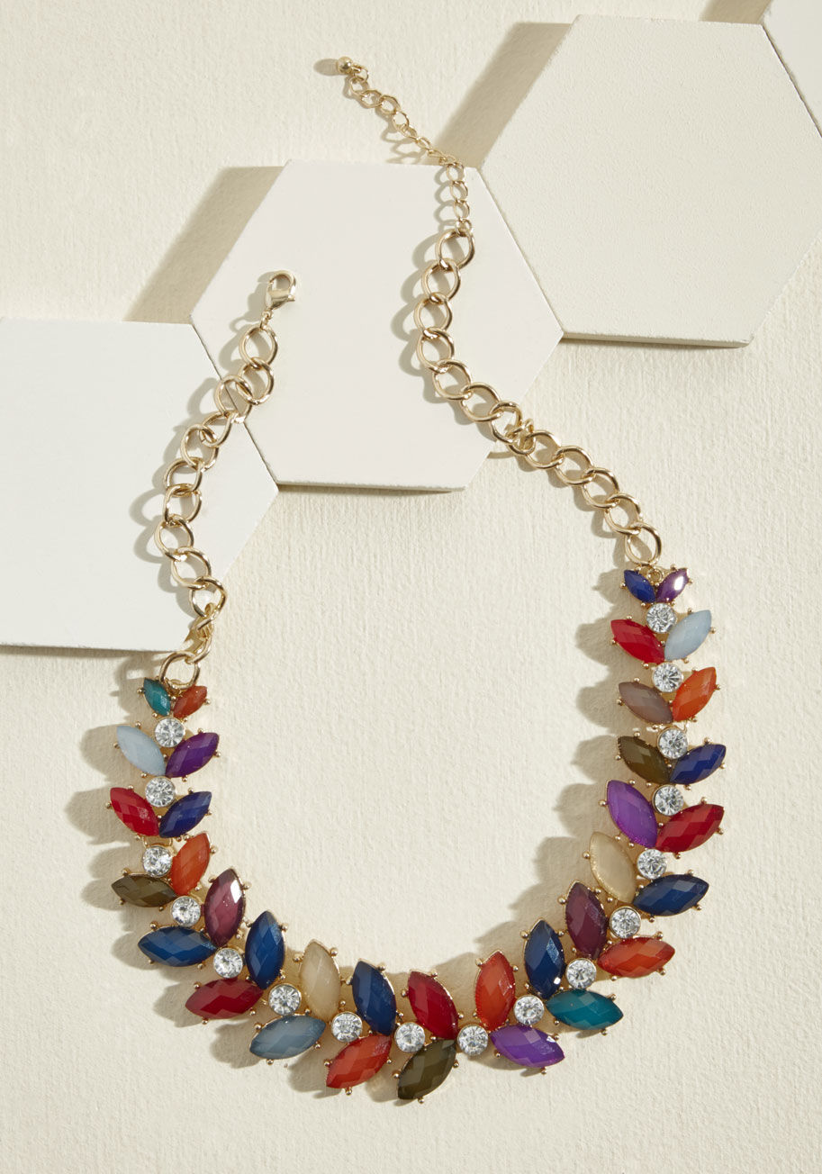 XPSTSN1158-X - Bring brilliance into your day by wearing this ModCloth-exclusive statement necklace and humming an upbeat tune! Featuring a bushel of lustrous, leaf-like gems growing outward from a line of sparkling rhinestones, this glowing gold piece is a delightful c