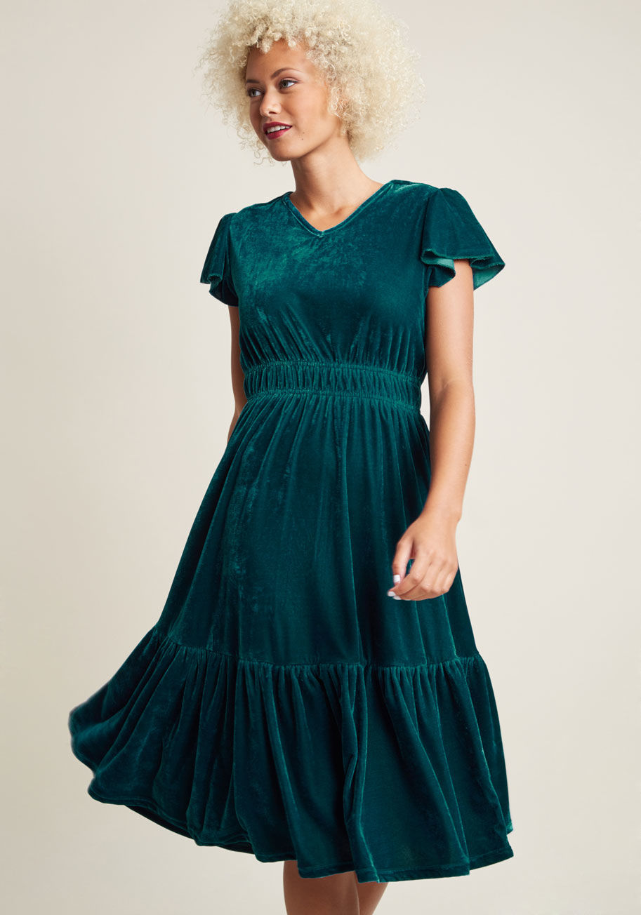 YD000708 - Carefree and charismatic, you take to the fete flaunting this teal midi dress and leave all