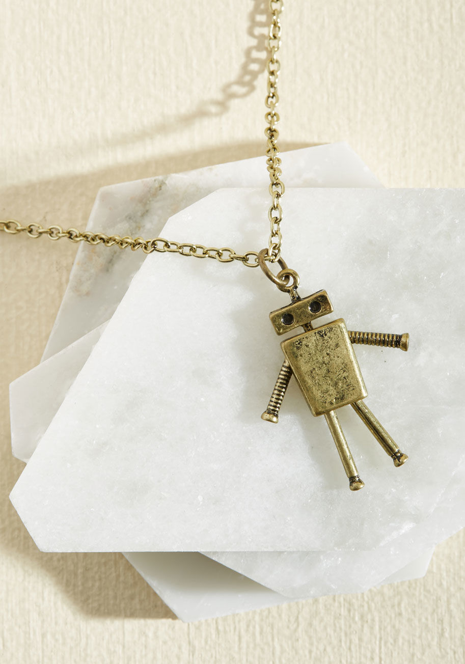 ZN4950GD - Get carried away dreaming of all the outfits that&rsquo;ll look complete with this antiqued gold necklace topping &lsquo;em off! A friendly robot pendant hangs at the end of a cable chain, starring movable arms and legs and putting a quirky spin on your f